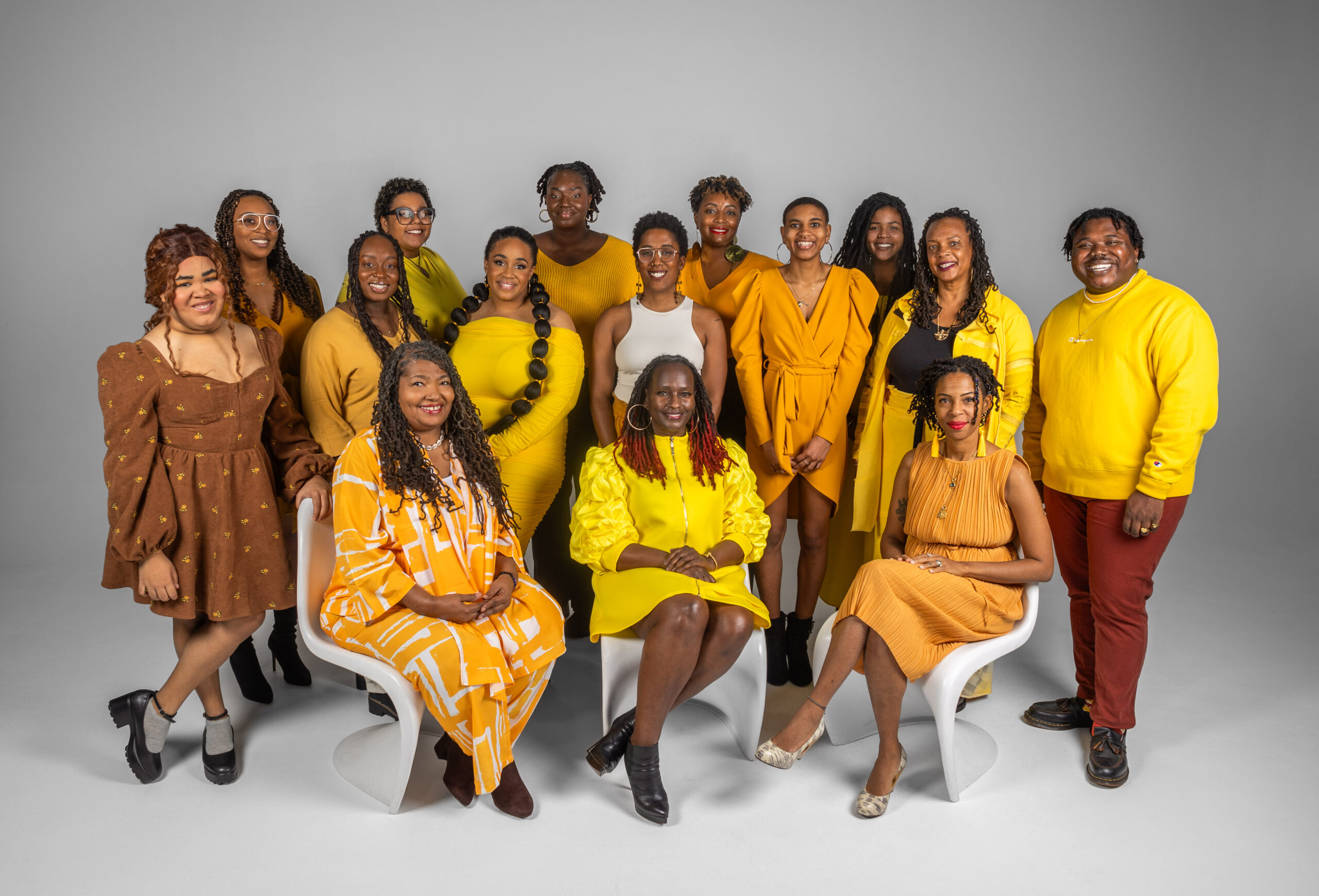Soul 2 Soul Sisters 2024 Full Staff and Board wearing different shades of yellow and amber.